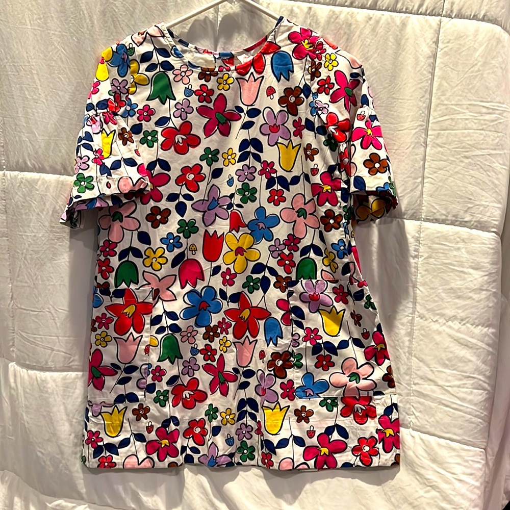 Bright floral dress with ruffle sleeves.